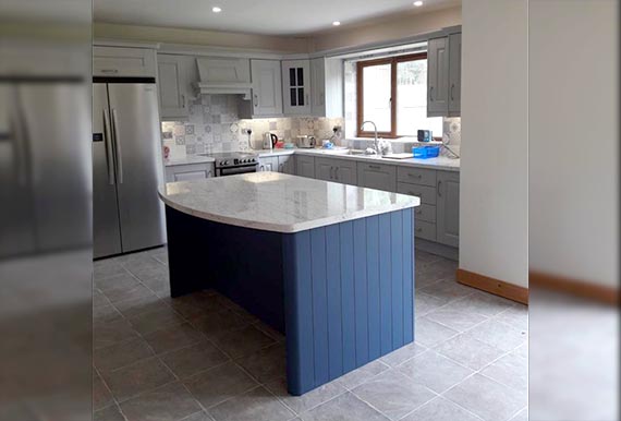 Light Grey Kitchen with blue kitchen island Image