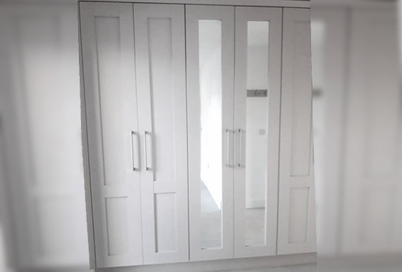 Pure white fitted wardrobes Image